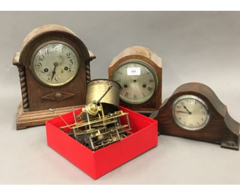 Three mantle clocks and a quantity of clock parts