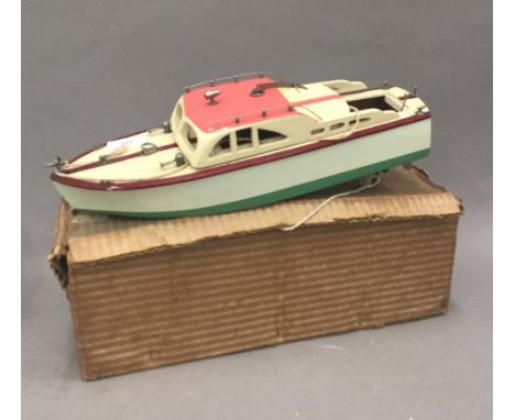 A vintage boxed model motorboat