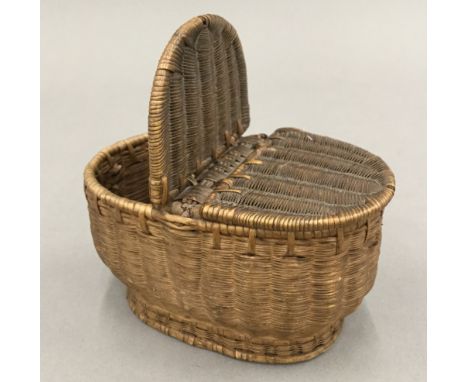 A vintage miniature wicker creel basket