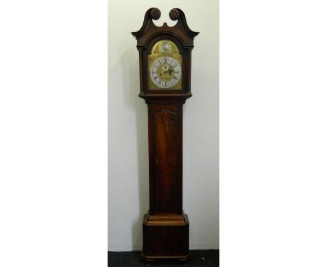 An 18th century mahogany cased longcase clock, the rosette carved arched broken swan-neck pediment above the brass face, the 