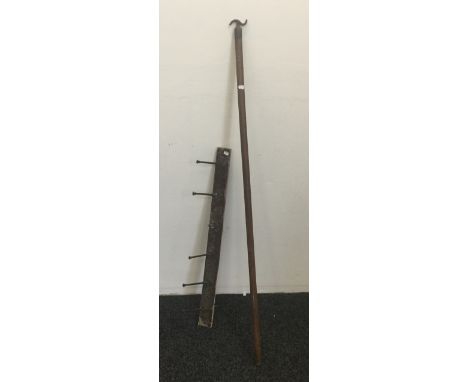 A vintage coat hook and a window pull