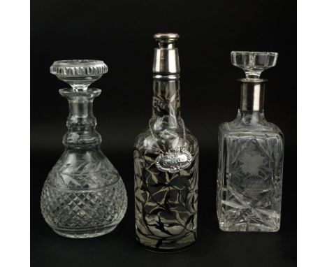 Grouping of Three (3) Decanters. Includes: two etched crystal and one overlay decanter. Overlay decanter has a Italian sticke