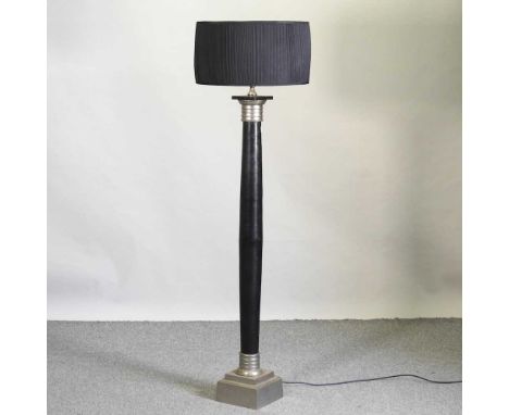 A modern black painted standard lamp and shade161cm high