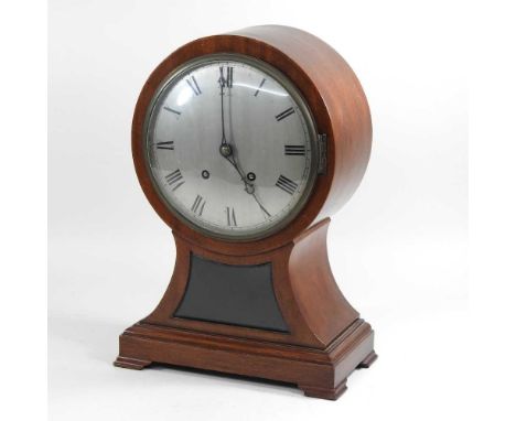A large Edwardian mahogany cased balloon shaped mantel clock, with an eight day movement striking on a gong41cm high