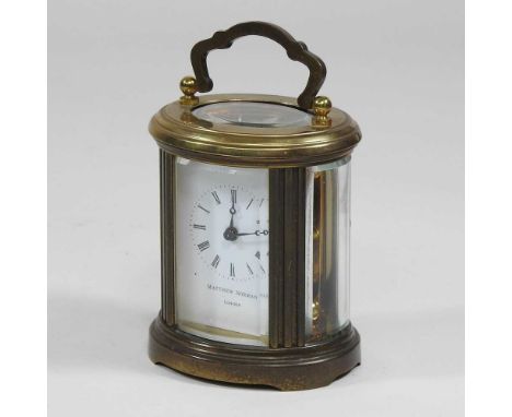 A small brass cased carriage clock, in an oval case11cm high