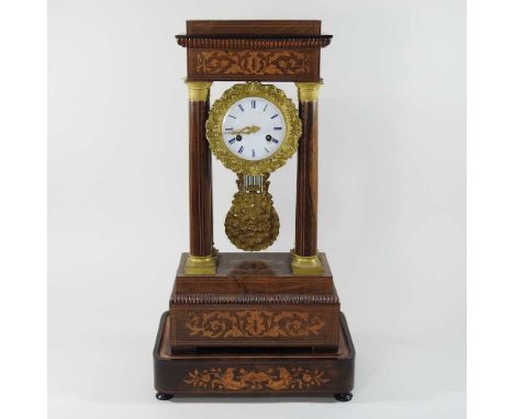 A Napoleon III rosewood and marquetry portico clock, with a white enamel dial, on a plinth base, with key30w x 20d x 55h cm