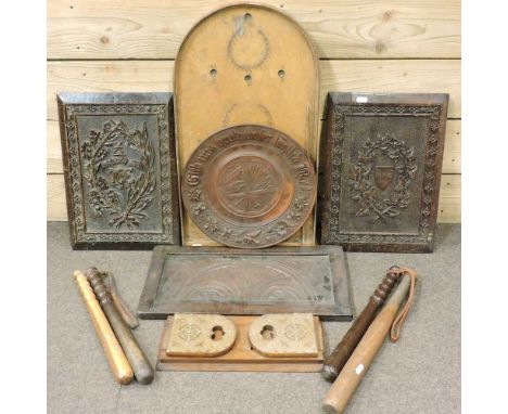 A pair of carved panels, together with other, truncheons, a book slide and bagatelle boardlargest panel 29w x 41h cmCondition