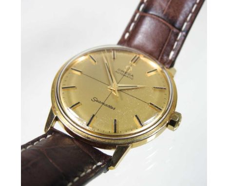 An Omega Seamaster gold plated automatic vintage wristwatch, the signed dial, with baton hours, on a later brown leather stra