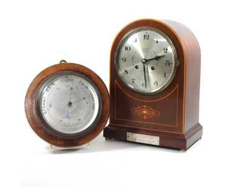 An early 20th century mahogany and inlaid mantel clock, by Zahra Malta, with a presentation plaque dated 1930, together with 