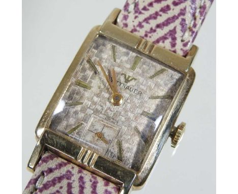 A Wittnauer 10 carat gold filled vintage wristwatch, the signed textured square dial, with baton hours, on a patterned leathe