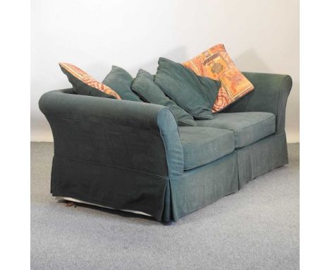 A modern green upholstered sofa, with loose cushions208w x 89d x 75h cm