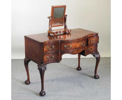 An early 20th century mahogany dressing table, in the Chippendale style, together with a Victorian swing frame toiletry mirro