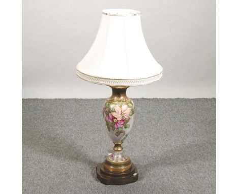 A large pottery table lamp, hand painted with flowers and shade87cm high overall