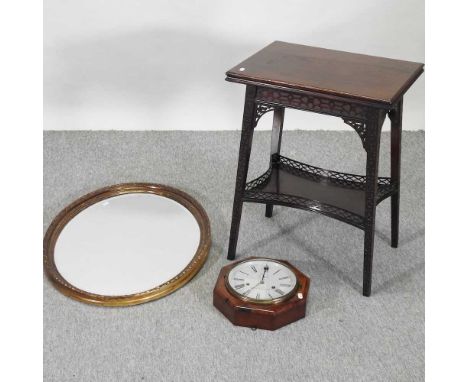 An early 20th century patent dial clock, 28cm diameter, together with an Edwardian fret carved folding card table and a gilt 