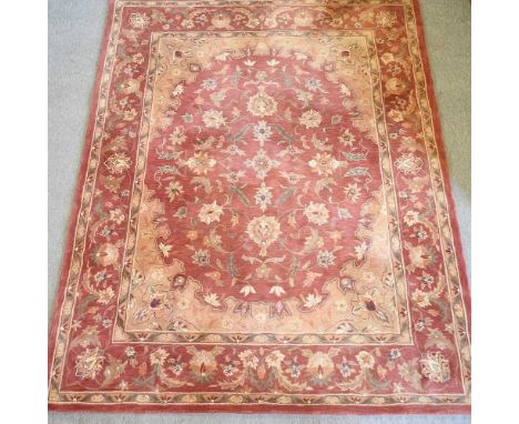 A Persian woollen carpet, with foliate design, on a red ground, together with a matching runner, 270 x 75cm (2)Carpet 303 x 2