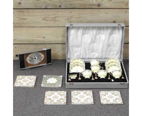 A Royal Albert part teaset, in a fitted case, together with a collection of antique tiles and a 1960's Metamec mantel clock