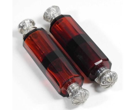 A 19th century ruby glass double ended scent bottle, with silver plated mounts, together with another similar (2)10cm longCon