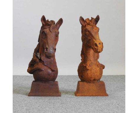 A pair of rusted metal horse head gate finials18w x 30d x 45h cm