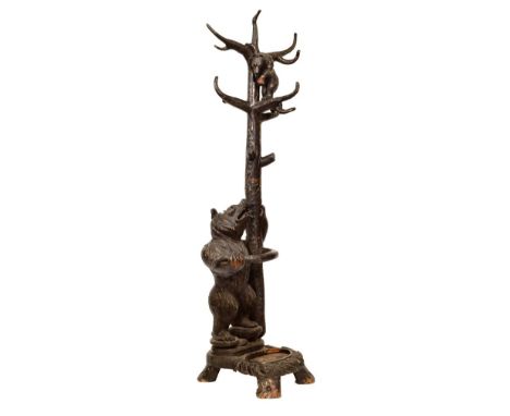 Early 20th Century 'Black Forest' carved wooden bear hallstand, modelled as a standing adult bear holding a tree trunk and wa