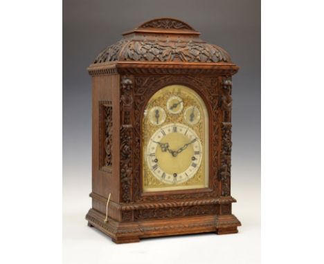 Early 20th Century German carved oak three-train chiming bracket clock, Winterhalder &amp; Hoffmeier, the 19cm arched brass d