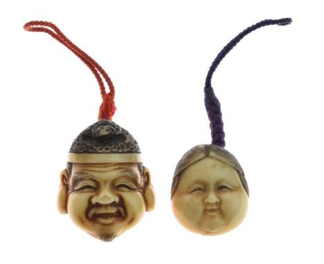 Two Japanese vegetable ivory mask netsuke formed as the face of a bearded man wearing a cap and a smiling lady, each with ill