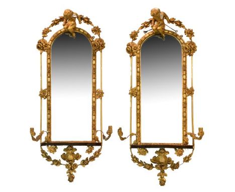 Pair of 19th Century giltwood pier mirrors or girandoles, each having an arched plain plate within egg and tulip surround, se