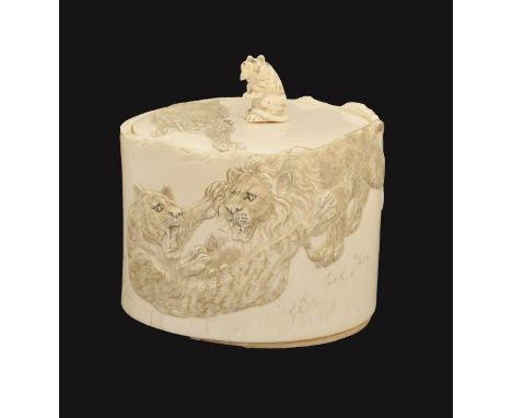 Japanese carved ivory oval box and cover, Meiji period, decorated with grappling lions and tigers, the cover with a seated ti