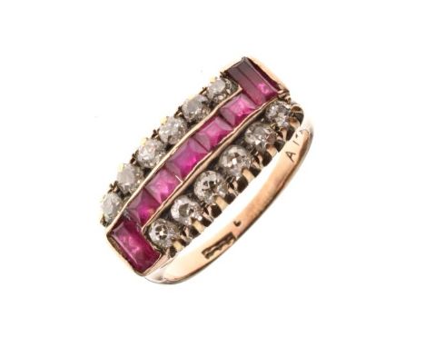 Diamond and calibré ruby ring, indistinctly marked, the central line of rectangular cut stones with a baguette cut to either 