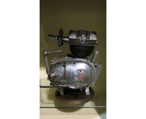 A Moto Parilla 175cc engine and gearbox unitengine number 405281, fitted with carburettor and mounted on base, condition and 