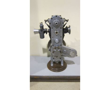 An unidentified Four-stroke OHC engineengine number B279, with carburettor and flywheel attached, mounted on base, condition 