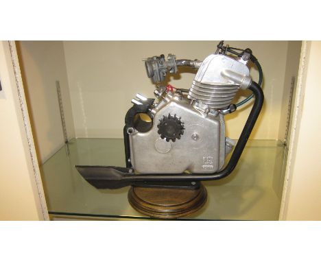 A Ducati Cucciolo clip-on engineengine number 301165, mounted on base, fitted with a carburettor and exhaust, condition and c