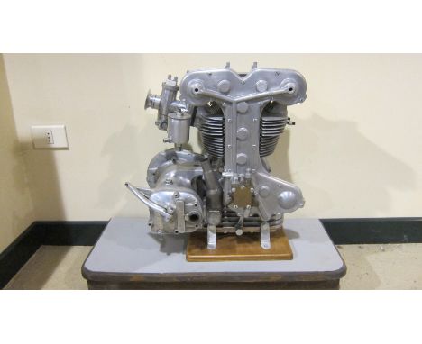 A Benelli DOHC engine and gearboxunnumbered, fitted with primary chaincase, carburretor and magneto,  mounted on base, togeth