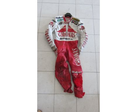 A set of Vallese Racing Motorcycle Leatherssize unknown, with Coronas, Honda, Vallese, Elf, Dunlop, United Colours of Benetto