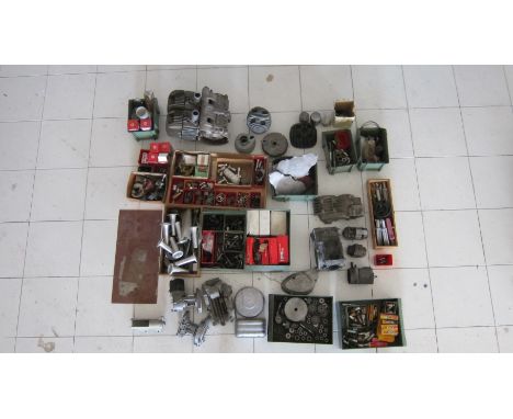 An autojumblers lotof mainly engine components, including pistons, spark plugs, castings, Motobi twin castings, Laverda engin