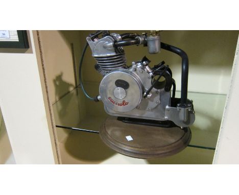 A Ducati Cucciolo clip-on engineengine number 28598, mounted on base, fitted with a carburettor and exhaust, condition and co