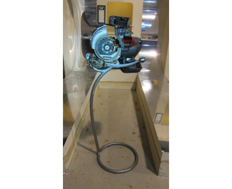 A Piaggio cutaway enginesectioned throughout, mounted on an elevated stand, close inspection advised. Lot to be sold without 
