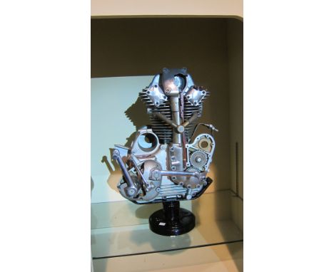 A Moto Parilla OHC engine and gearbox cutawaysectioned throughout, mounted on a rotating base, close inspection advised. Lot 