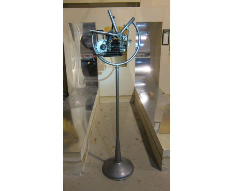 A believed Mineralli cutaway enginesectioned throughout, clamped to a display section of frame, mounted on elevated and rotat