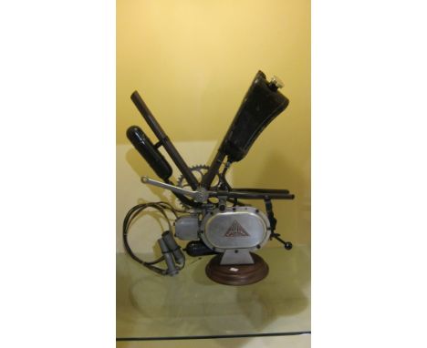 A Lohmann Two-stroke clip-on bicycle engineengine number 033859, with display sections of bicycle attached, together with pet