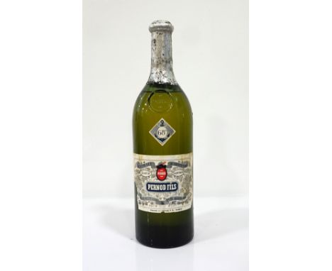 PERNOD FILS COUVET SUISSE ABSINTHE C. 1940'S
A rare and well preserved bottle of Pernod Fils Couvet Suisse Extrait D'Absinthe