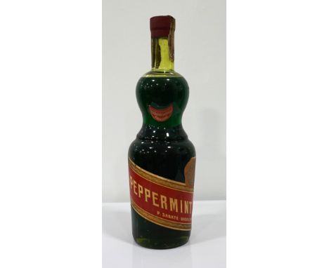 PEPPERMINT LIQUEUR - EDUARDO GARRIGA CA. 1940-1950
A beautifully shaped bottle of Peppermint Liqueur from legendary producer 