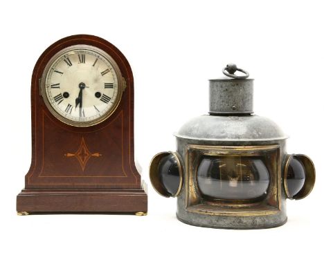 An Edwardian strung mahogany mantel clock, 33cm high, and a river boat light with original burner (2)