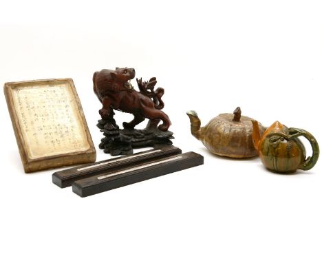 A Chinese pottery tile, Kangxi, with list of patrons names, 22cm high, a pair of paper weights, with dragons, a wood carving 