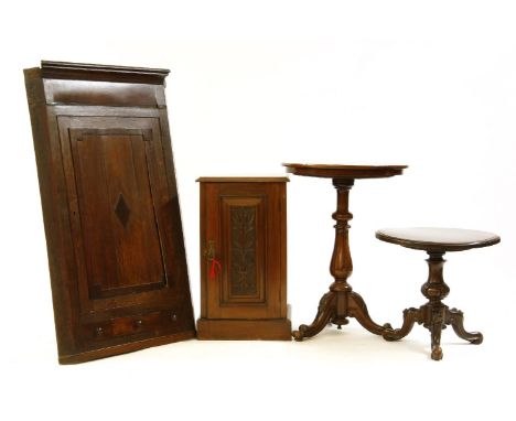 A Victorian walnut pot cupboard, two tripod tables, and a hanging corner cupboard