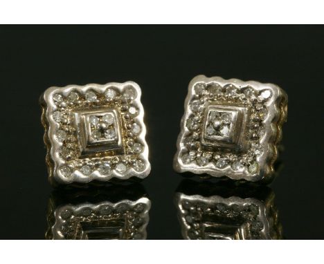 A pair of 9ct two-colour gold square two-tier diamond cluster earrings, with post and butterfly fittings. 2.30g (2)