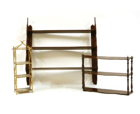 A three tier fret cut mahogany wall shelf, 93cm wide, a smaller mahogany wall shelf and a small gilt three tier hanging shelf