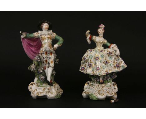 A pair of Derby 'patch' figures, on in the form of a male figure, standing in front of a bocage, and a female figure wearing 