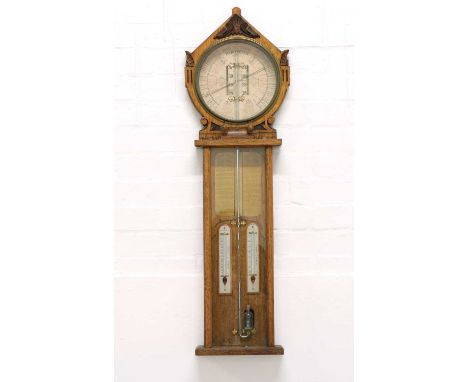 An oak cased Royal Polytechnic barometer, with circular dial and angular pediment, 86cm high