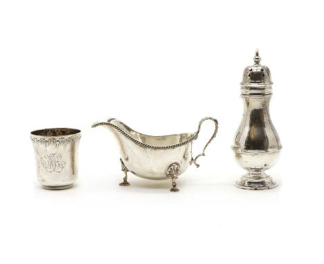 A George III style silver sauce boat, Sheffield 1946, on shell feet, together with a sugar castor of plain baluster form, Lon