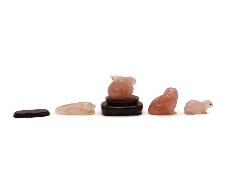  A group of Chinese rose quartz carvings, comprising: a rabbit, 5.2cm long, wood stand, a seal, 8cm long, a dog, 5.7cm long, 